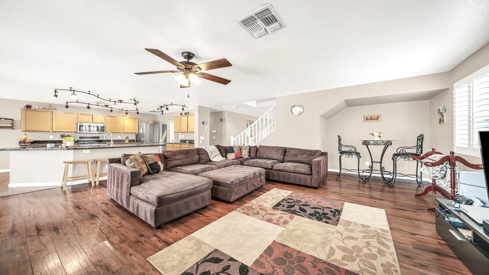 Open concept living room sectional sofa kitchen real estate photography Glendale AZ | The Listing Bees