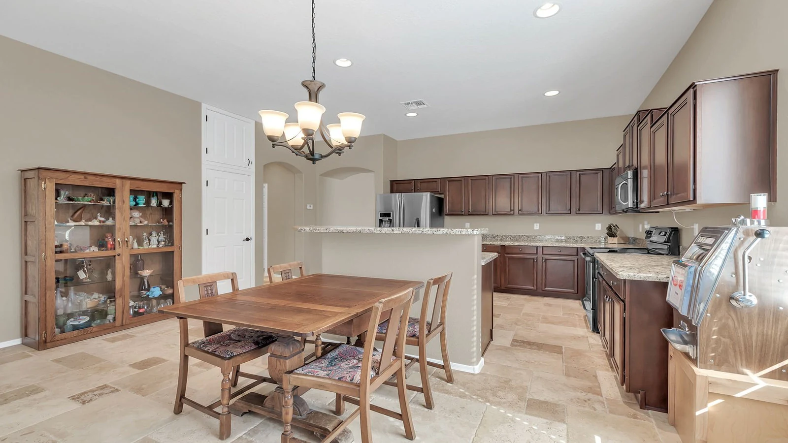 Dining area wooden table hutch adjacent kitchen real estate photography Gold Canyon AZ | The Listing Bees