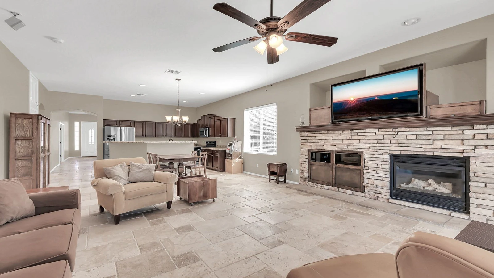 Living room stone fireplace TV open kitchen real estate photography Gold Canyon AZ | The Listing Bees