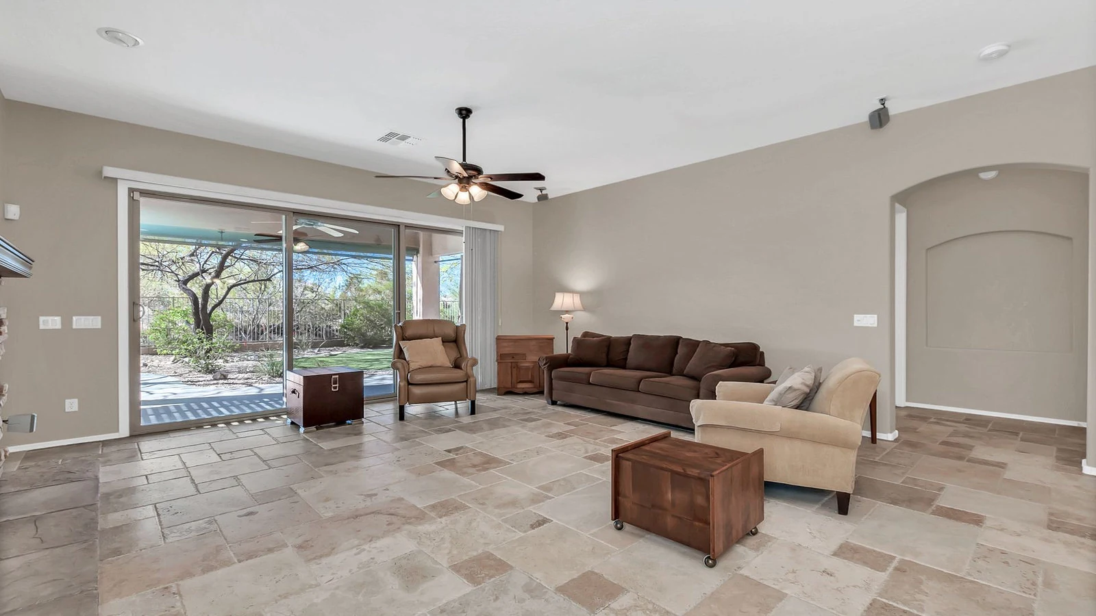 Living room brown couch armchairs patio view real estate photography Gold Canyon AZ | The Listing Bees