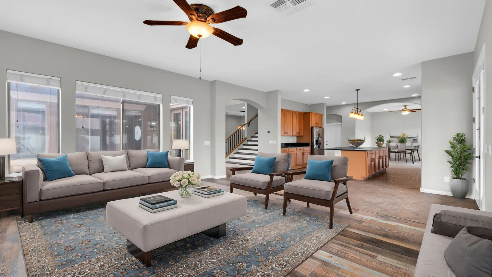 Modern living room sofa chairs open-plan kitchen real estate photography Queen Creek AZ | The Listing Bees