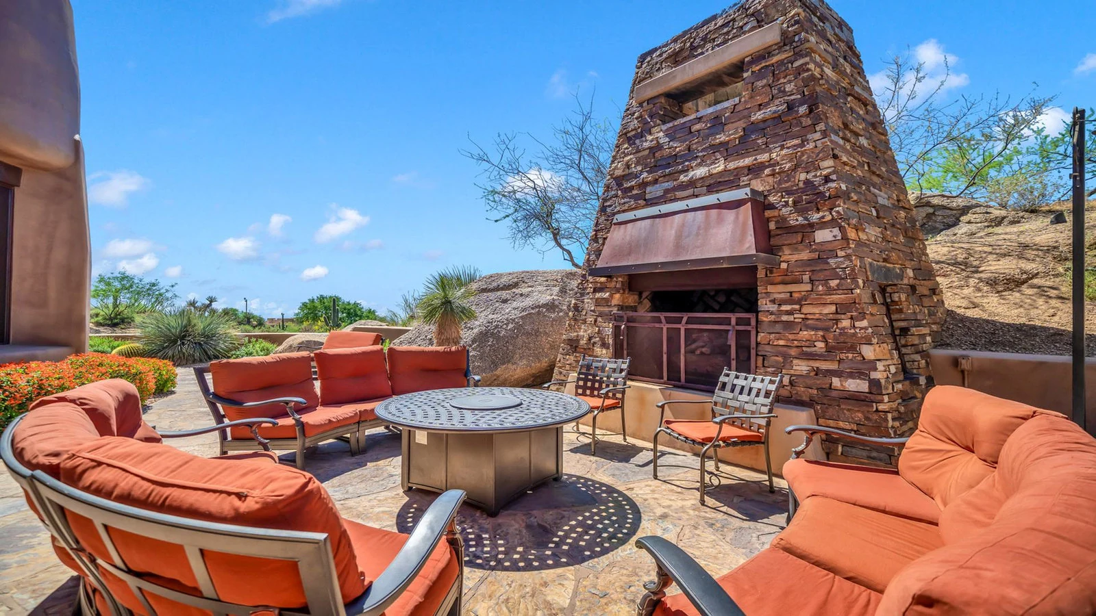 Outdoor patio seating stone fireplace real estate photography Scottsdale AZ | The Listing Bees
