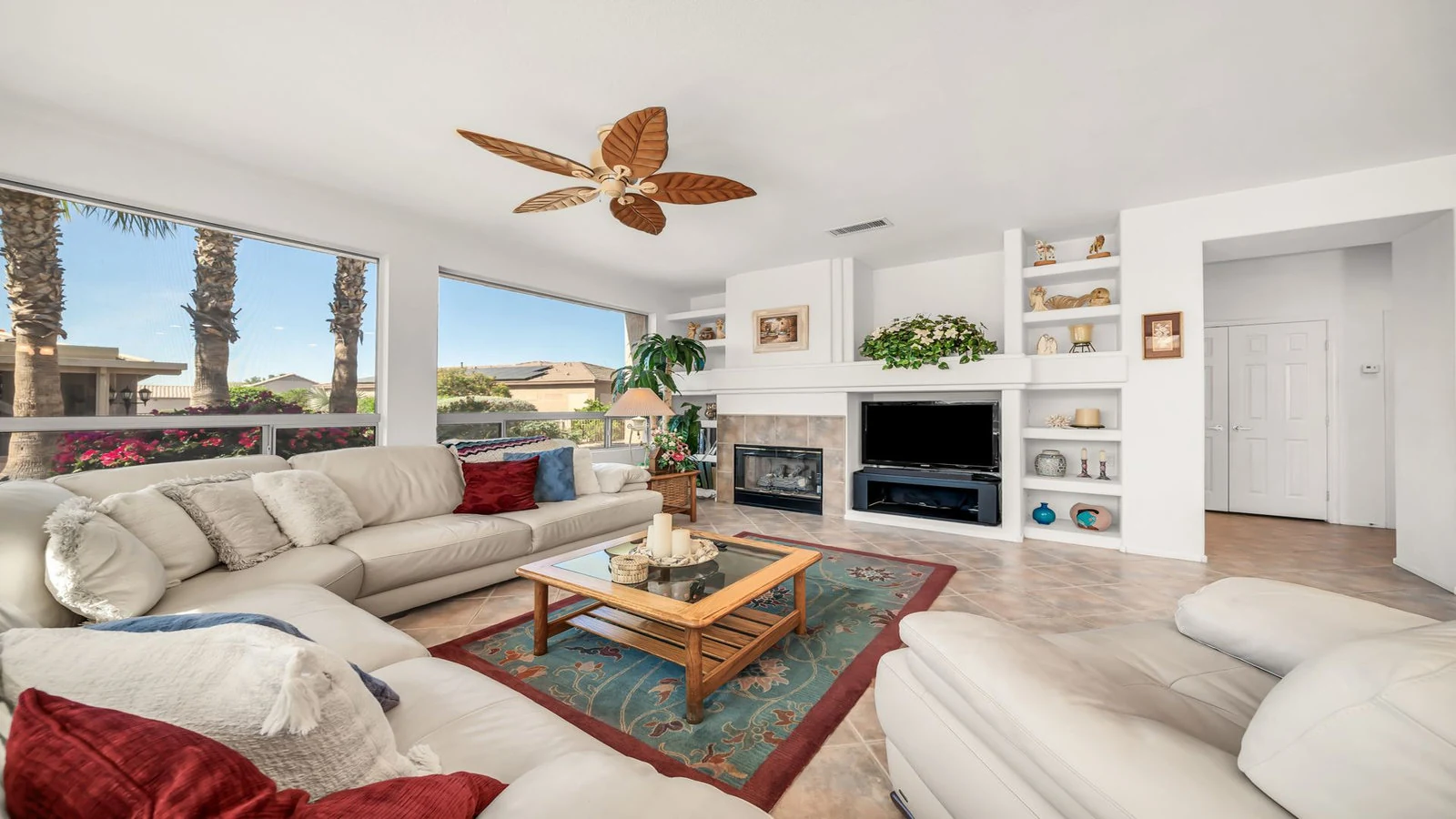Living room sectional sofa fireplace windows real estate photography Surprise AZ | The Listing Bees