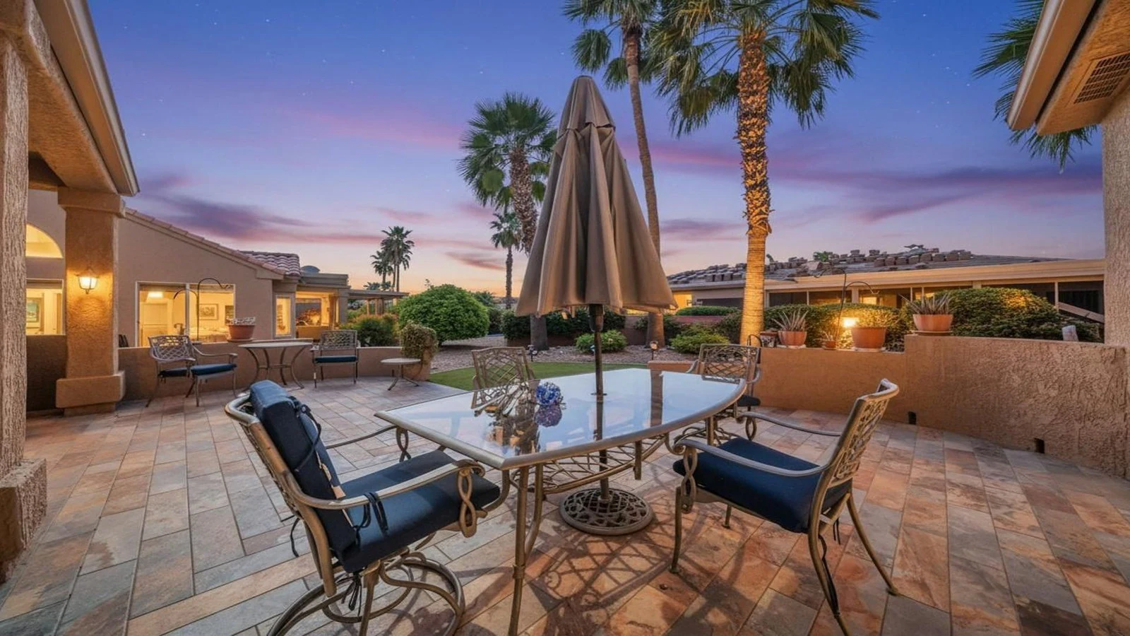 Outdoor patio dining set palm trees dusk real estate photography Surprise AZ | The Listing Bees