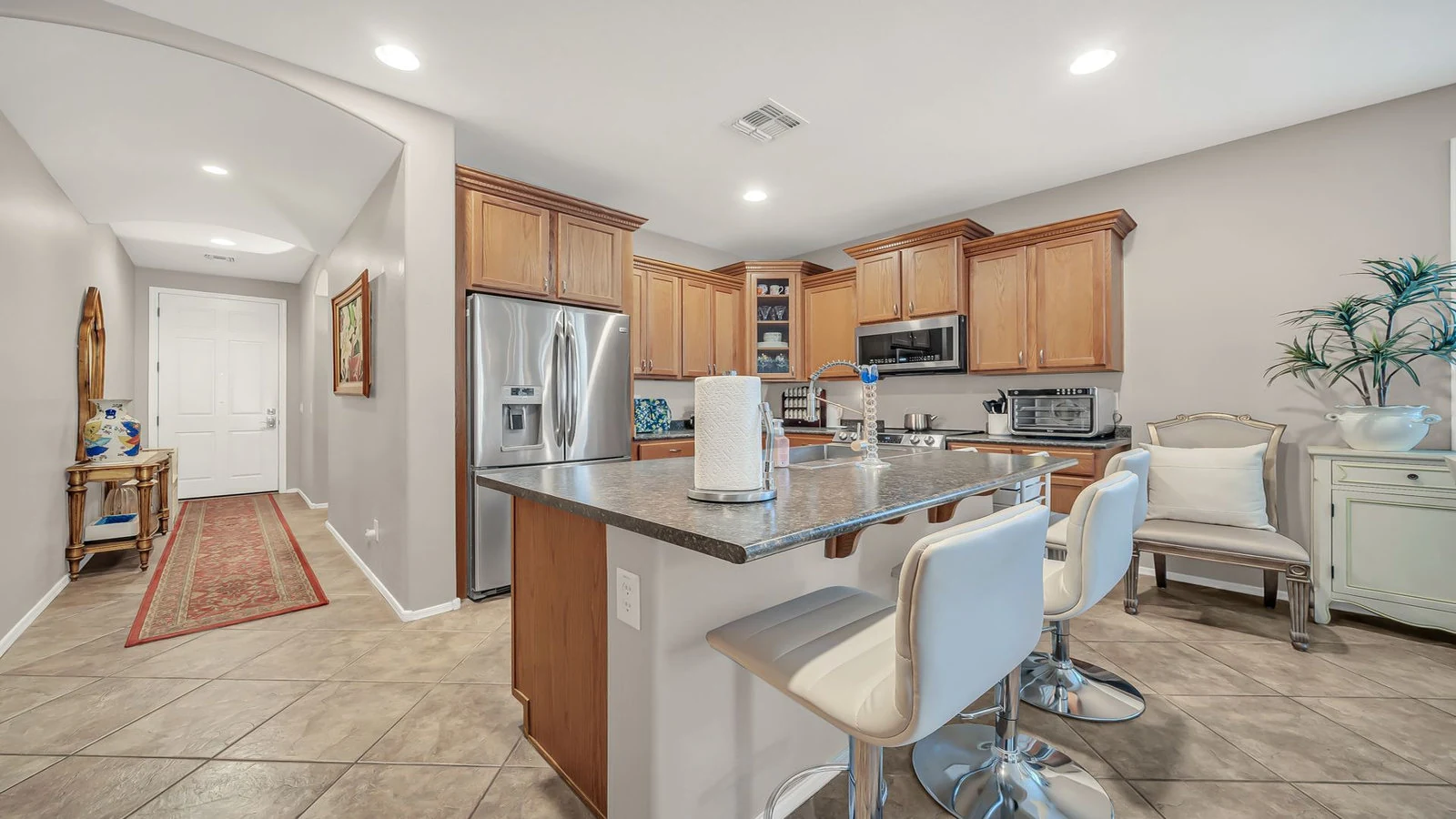 Modern kitchen island wood cabinets stainless appliances real estate photography Surprise AZ | The Listing Bees