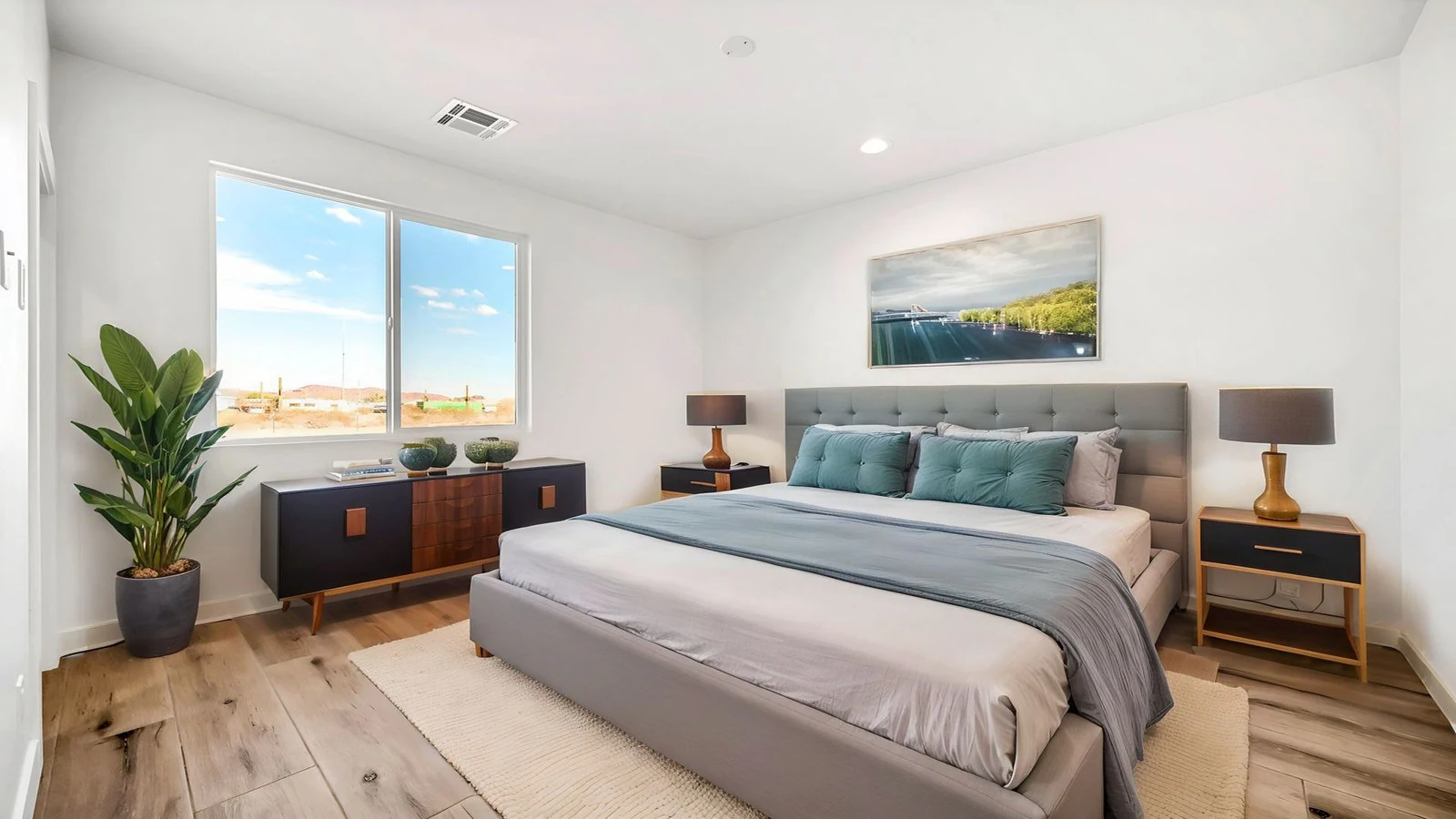 Contemporary bedroom large window gray bed real estate photography Surprise AZ | The Listing Bees