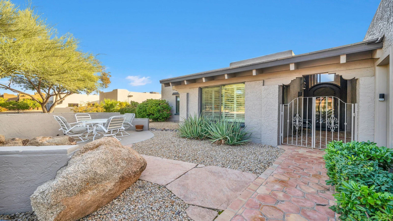 Rio Verde home exterior with patio and desert plants