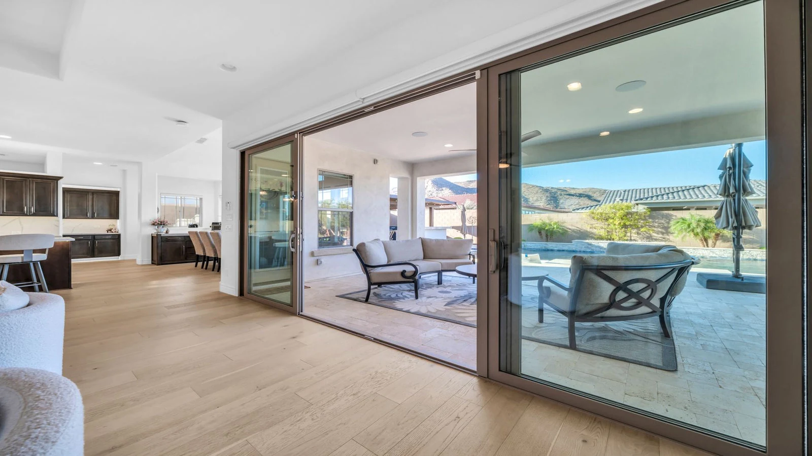 Sliding glass doors connect living room to patio