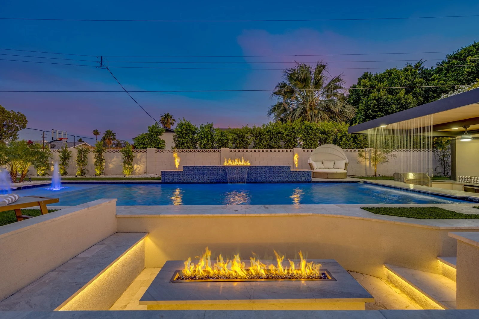 Twilight photo of a Scottsdale backyard pool with a fire feature, photographed for a Silverleaf listing