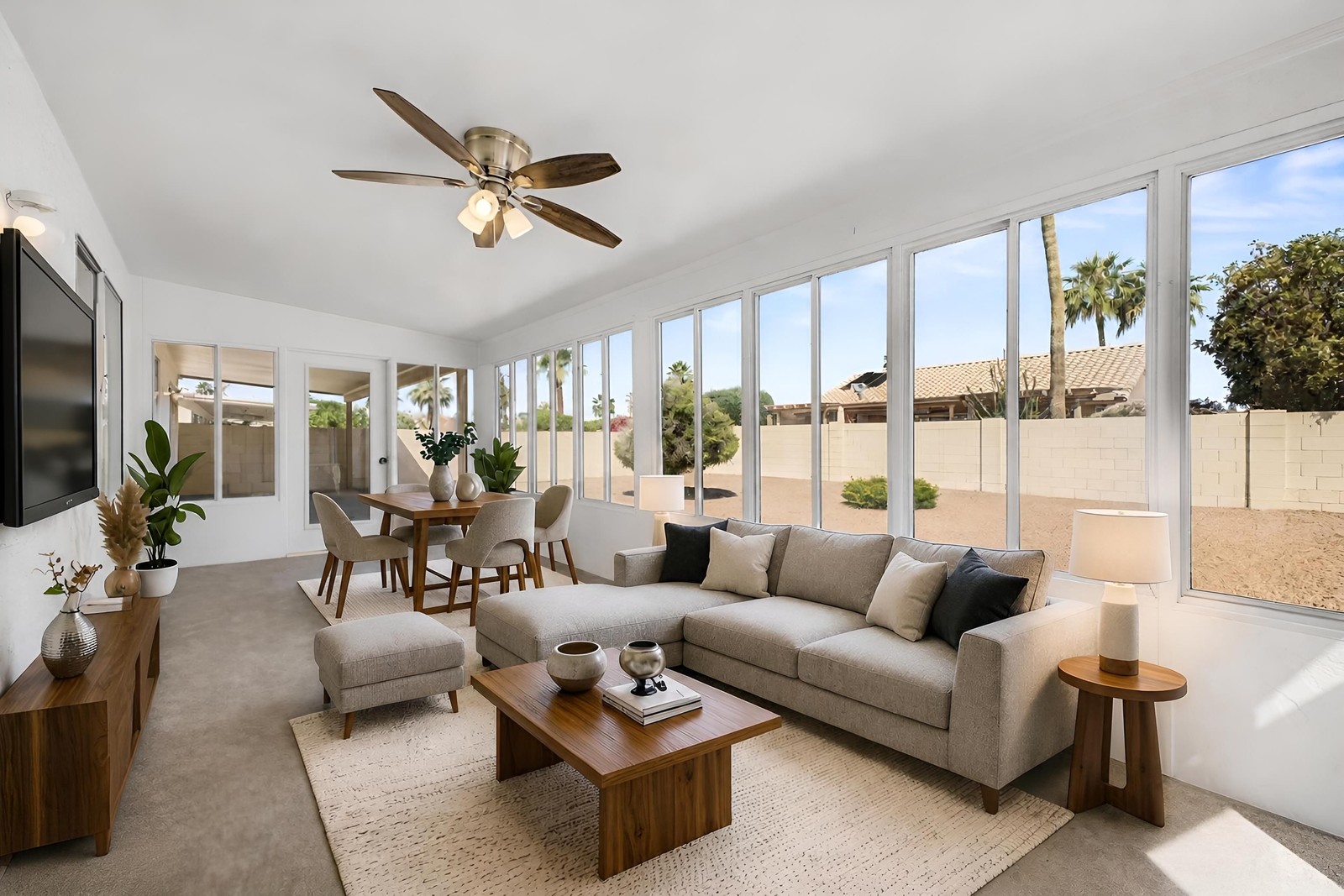 The same Arizona room virtually staged as a lounge with a sectional and dining nook