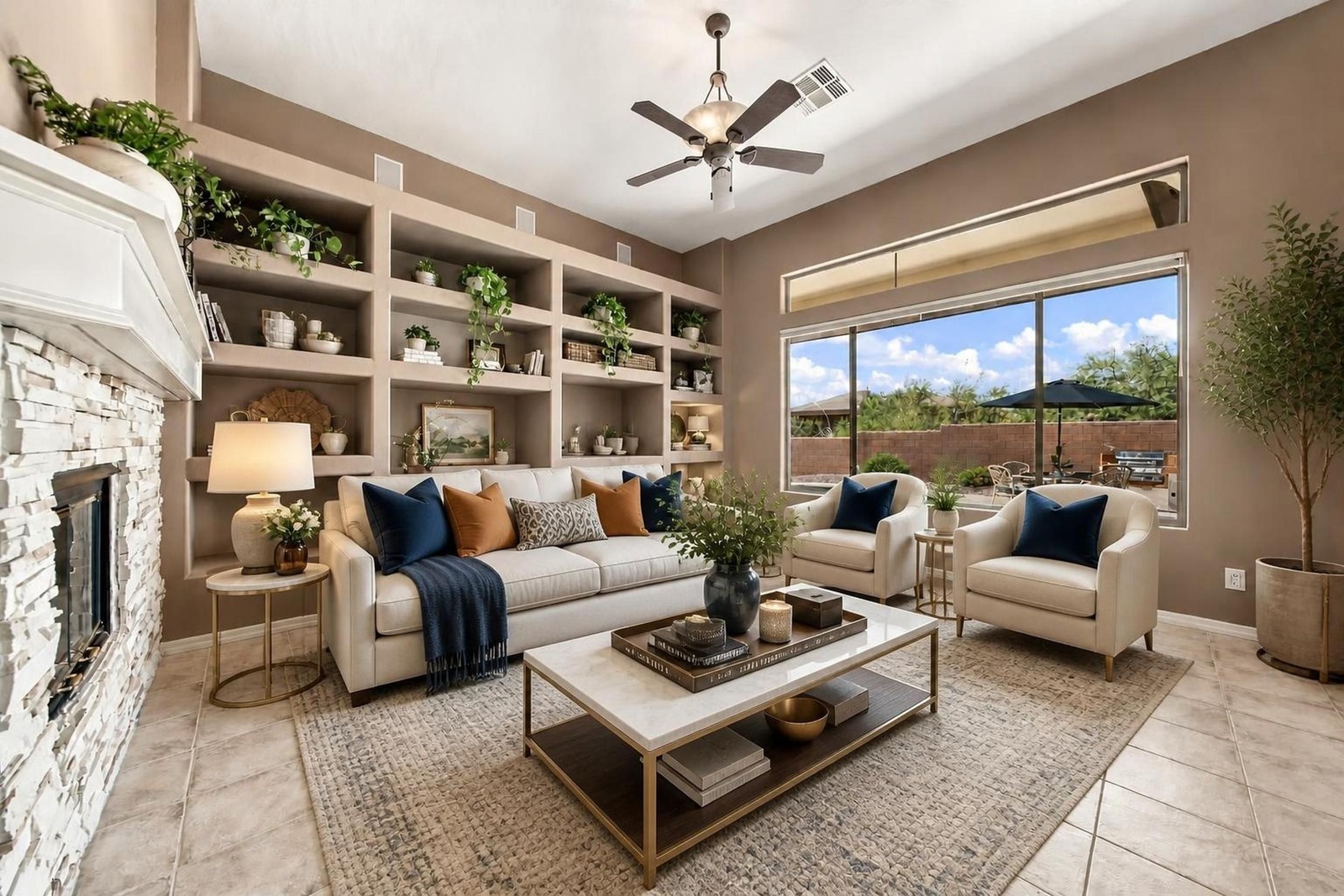 The same family room virtually staged with sofas, a coffee table and styled shelves